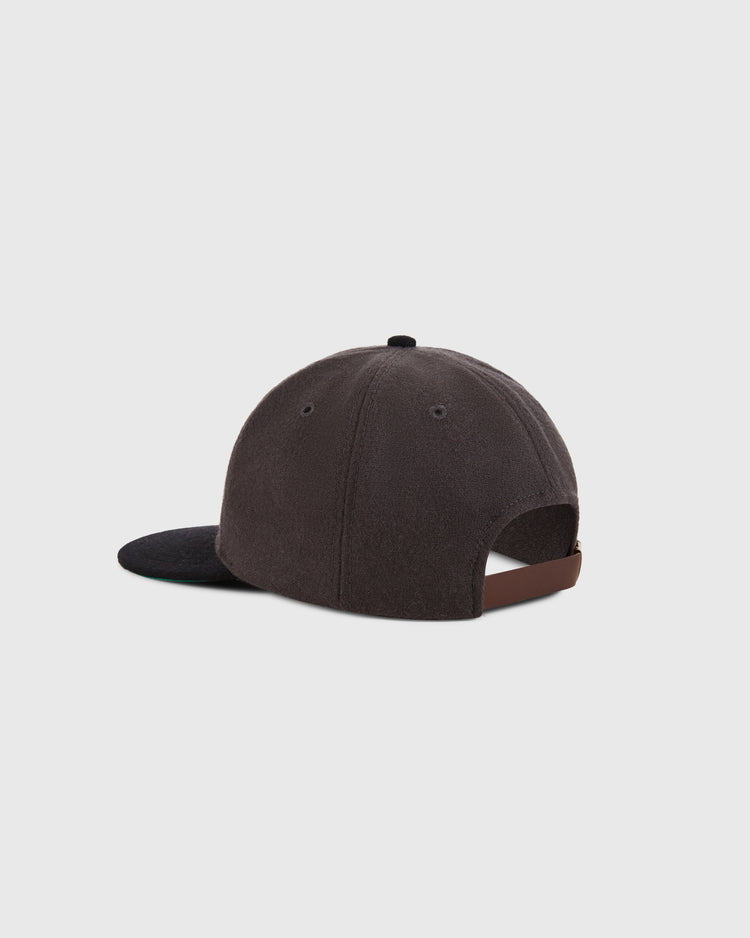 The Osaka Tigers 1940 Wool Ballcap by Ebbets Field is shown from the back, with a dark brown wool design, curved brim, and an adjustable brown strap with a metal buckle set against a plain white background.