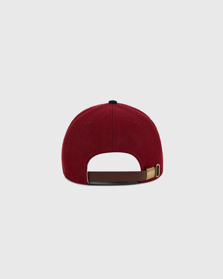 The Ebbets Field San Francisco Seals 1940 Wool Ballcap, in maroon, is shown from the back with an adjustable brown strap and brass buckle on a plain light gray background, evoking classic Pacific Coast League style.