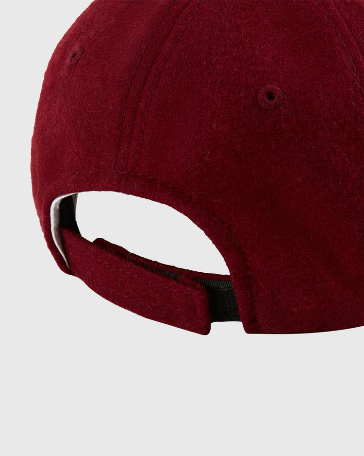 Close-up of the back of the Ebbets Field San Francisco Seals 1940 Wool Ballcap (Youth Size), in red wool fabric, with a black Velcro adjustable strap, set against a plain light background.