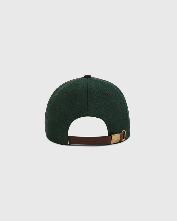 The Ebbets Field Los Angeles Angels (PCL) 1949 wool ballcap, in dark green, is shown from the back with a brown leather strap and brass buckle for size adjustment, standing out against a plain white background.