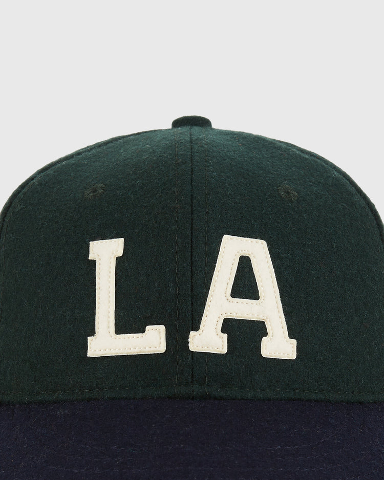 The Ebbets Field Los Angeles Angels (PCL) 1949 Youth Wool Ballcap features a dark green crown, large white 