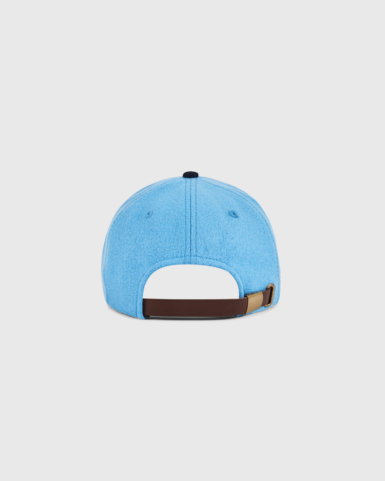 The Santurce Cangrejeros Crab Wool Ballcap by Ebbets Field, in light blue wool, is shown from the back and features a brown adjustable strap with metal buckle—evoking classic Puerto Rican baseball style.