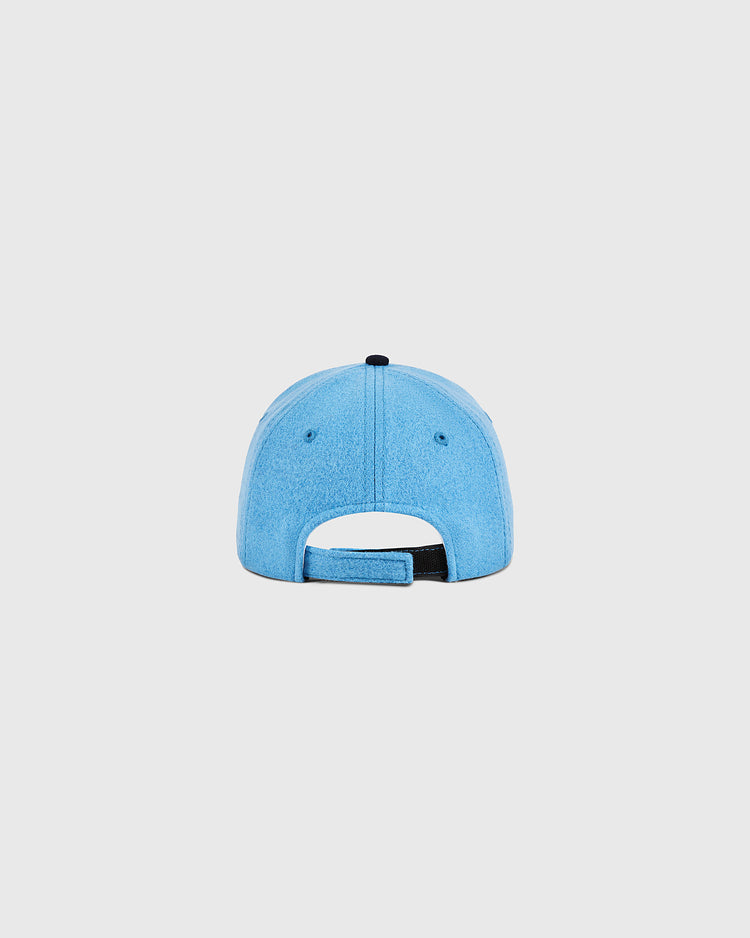 The Santurce Cangrejeros Crab Wool Ballcap by Ebbets Field, in youth size and light blue, is shown from the back with a black adjustable strap and top button, set against a plain white background.
