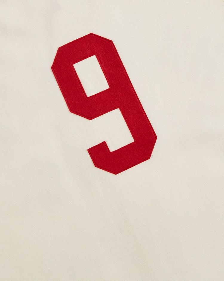 A bold red number 9, inspired by the classic uniforms of the 1929 Hilldale Giants, stands out at the center of an off-white background, capturing the vintage look and feel of the Ebbets Field Hilldale Giants 1929 Wool Home Authentic Jersey.