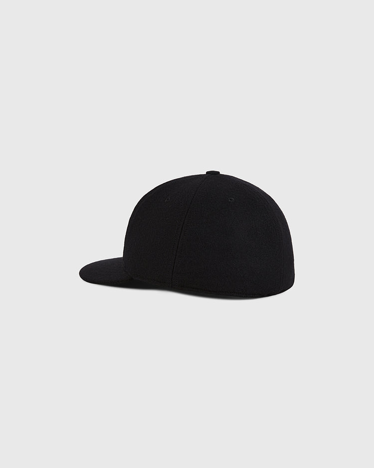 A Mexico City Tigres 1959 Authentic Wool Ballcap by Ebbets Field is shown from the back and side, featuring a flat brim and no visible logos or designs, set against a plain light gray background.