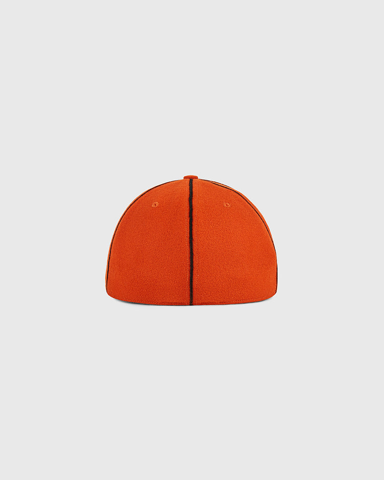 The Ponce Leones 1951 Authentic Wool Ballcap by Ebbets Field is displayed from the back against a plain white background, featuring a bright orange color, two visible seams running from top to bottom, and no visible logo or adjustable strap.