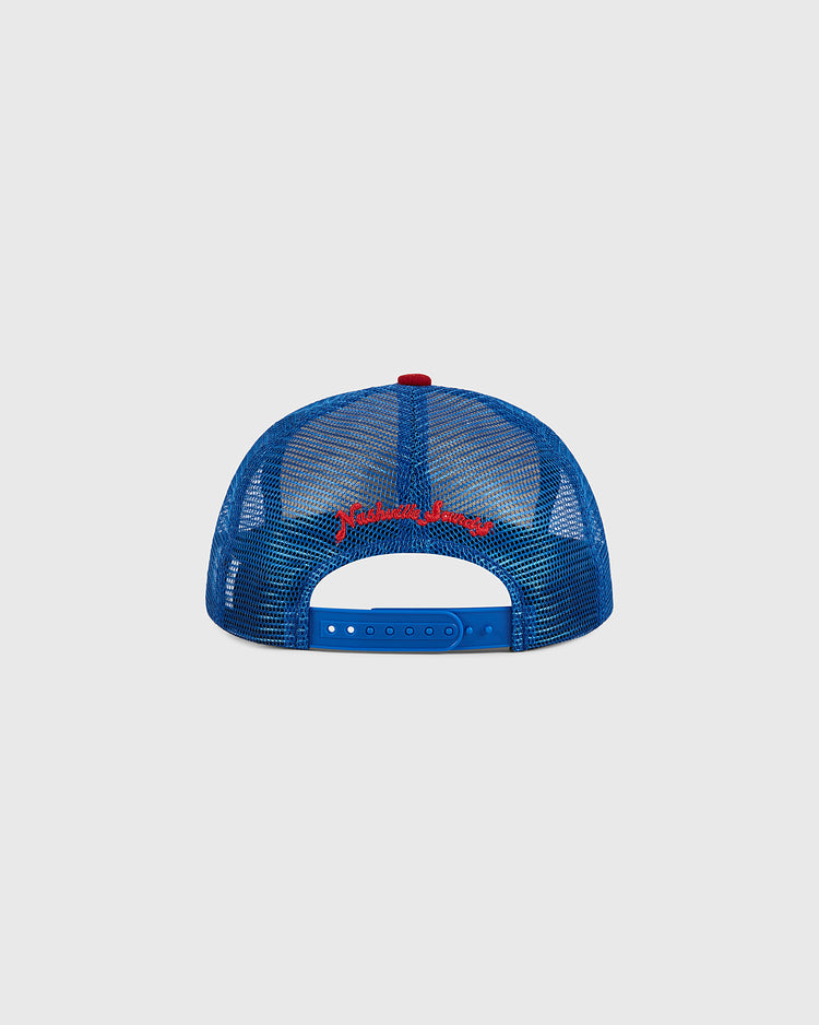 Ebbets Field Nashville Sounds Mesh Trucker Ballcap viewed from the back, showcasing red embroidered text above the adjustable strap, set against a plain light gray background.