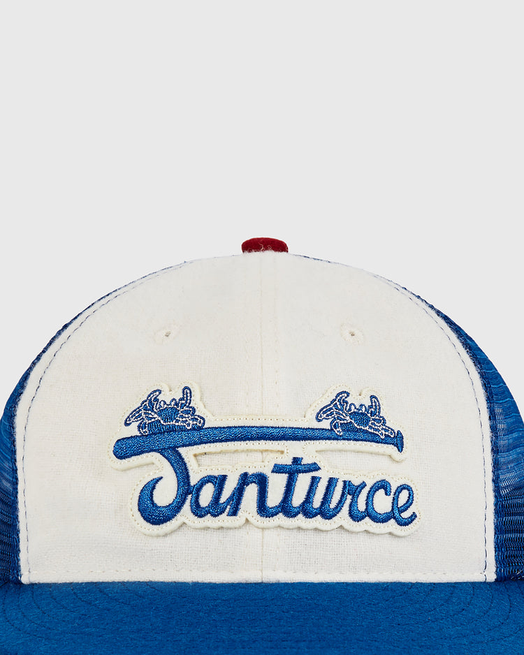 The Ebbets Field Santurce Wool Mesh Trucker Ballcap features a blue and white design with 