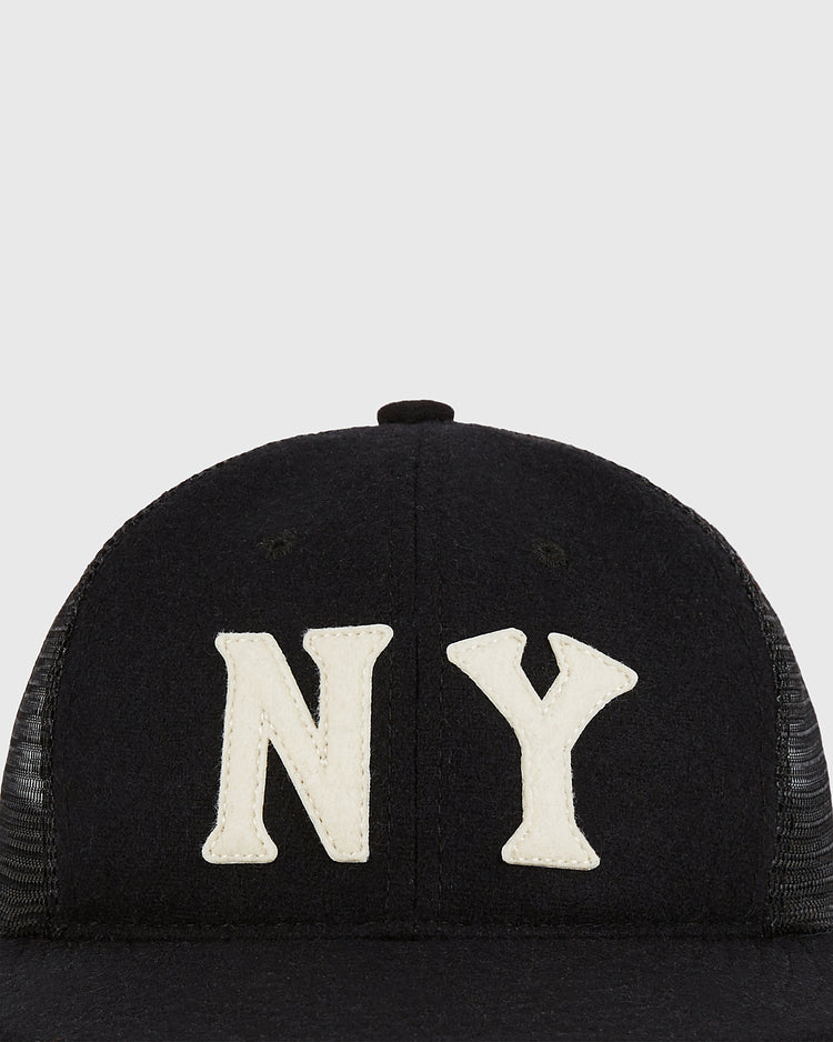 The Ebbets Field New York Black Yankees Mesh Trucker Ballcap, featuring prominent white 