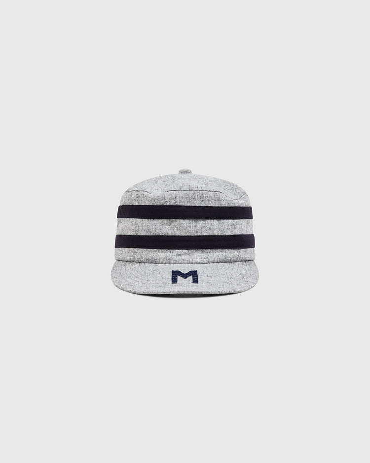 The Ebbets Field Milwaukee Brewers (AA) 1905 Pillbox Cap is a light gray vintage-style wool cap featuring two thick black horizontal stripes and a small dark blue “M” logo on the front, styled after classic Milwaukee Brewers designs. The cap is displayed on a plain white background.