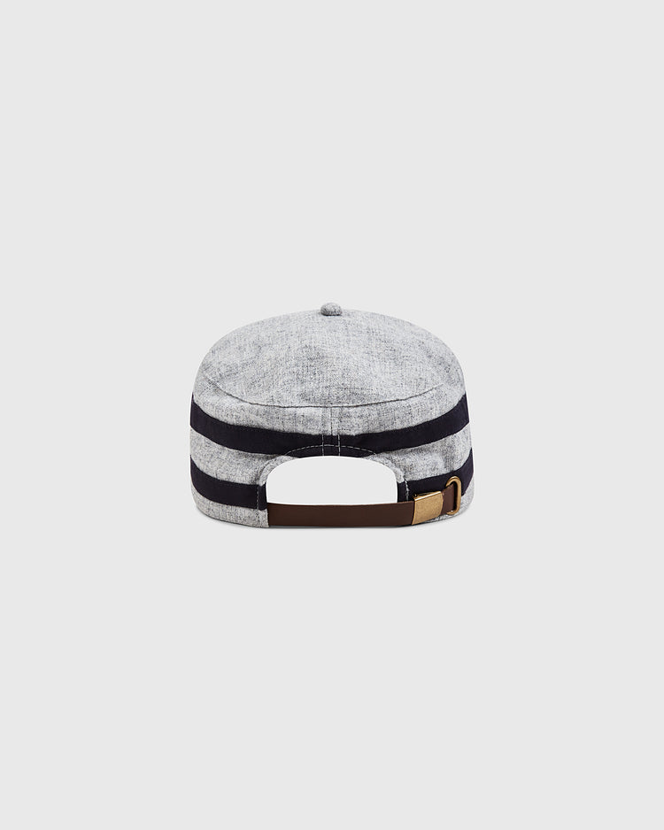 The Milwaukee Brewers (AA) 1905 Pillbox Cap by Ebbets Field is displayed from the back, highlighting its light gray and black stripes reminiscent of a vintage wool pillbox hat. An adjustable brown strap with a brass buckle is featured, set against a plain white background.