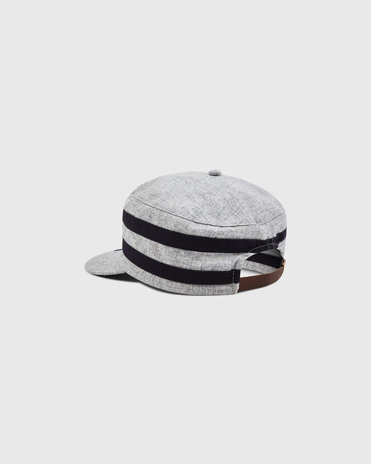 The Ebbets Field Milwaukee Brewers (AA) 1905 Pillbox Cap is a light gray, vintage-style wool hat featuring two thick black stripes, a small brim, and an adjustable brown strap at the back, evoking classic Milwaukee Brewers aesthetics. It is displayed against a plain white background.