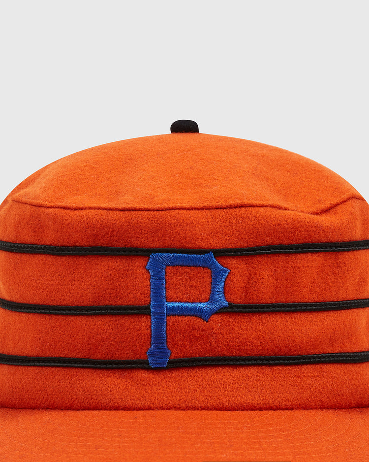 A front view of the Ebbets Field Phoenix Giants 1983 Pillbox Cap, featuring an orange body with black stripes and a blue embroidered letter P on the front, inspired by the classic Phoenix Giants style, set against a plain gray background.
