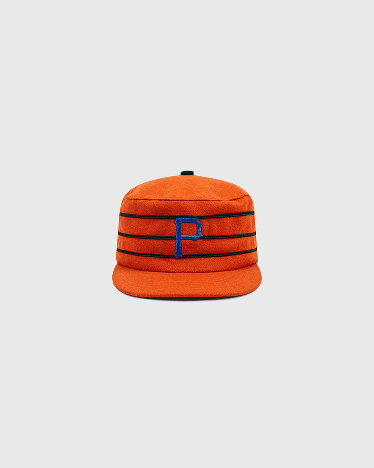An orange Ebbets Field Phoenix Giants 1983 Pillbox Cap with horizontal black stripes and a blue letter P on the front, displayed against a plain light gray background. This vintage wool pillbox cap is a faithful baseball hat reproduction that embodies the classic spirit of historic teams.