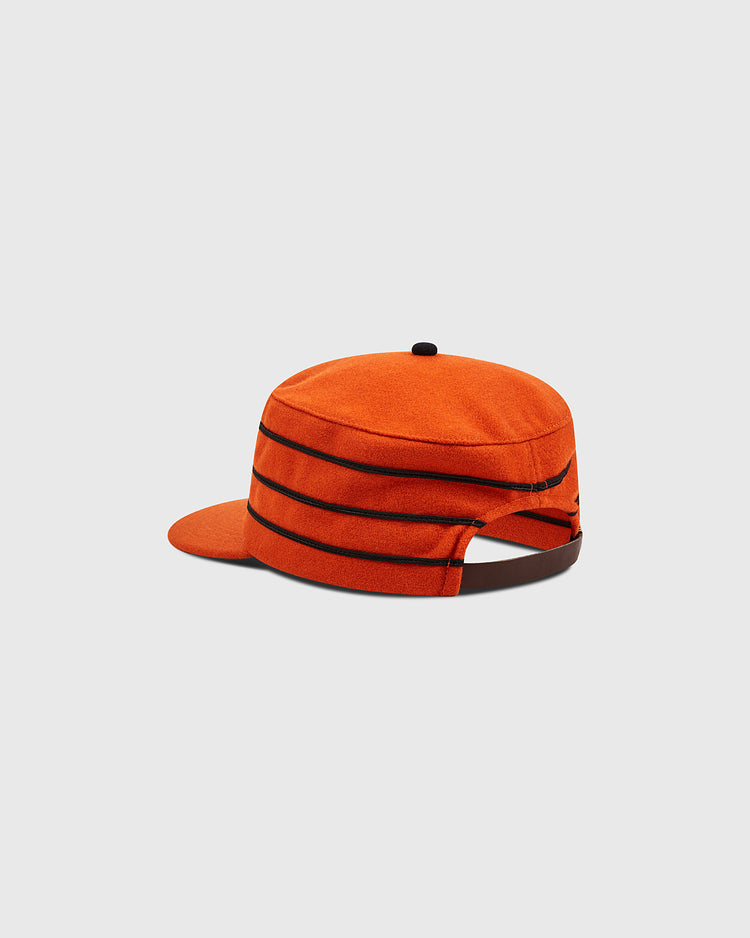 A Phoenix Giants 1983 Pillbox Cap by Ebbets Field, featuring an orange design with black horizontal stripes and a black adjustable strap at the back, displayed on a plain gray background.