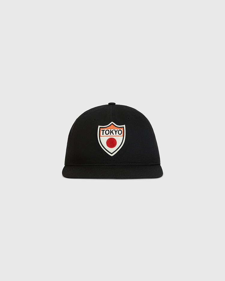 The Ebbets Field Tokyo Giants Patch Cotton Twill Ballcap features a shield-shaped patch on the front that reads “Tokyo” above a red dot, set against a plain light gray background.