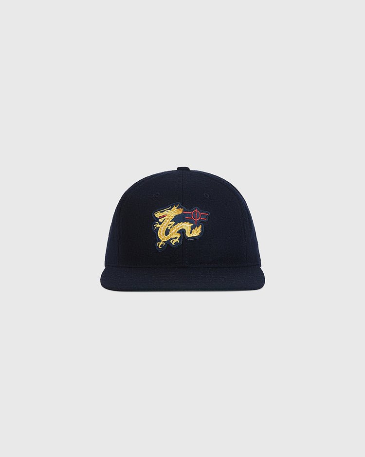The Ebbets Field Chunichi Dragons 1969 Wool Ballcap features a navy blue design with a yellow dragon and red accents embroidered on the front, styled after an authentic wool ballcap and displayed against a plain light background.