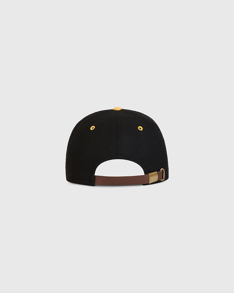 An Ebbets Field Nishitetsu Lion 1971 Authentic Wool Ballcap in black wool, shown from the back with a brown adjustable strap and brass buckle, finished with yellow eyelets and top button, set against a plain light gray background—a design inspired by the Fukuoka-era 1971 Nishitetsu Lions.