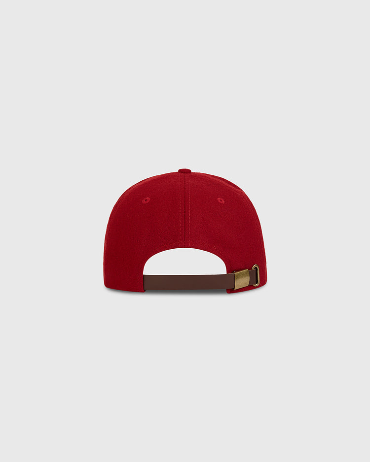 The Taiyo Cubs 1928 Authentic Wool Ballcap by Ebbets Field is shown from the back, highlighting its brown adjustable strap with a brass buckle, set against a plain light gray background.