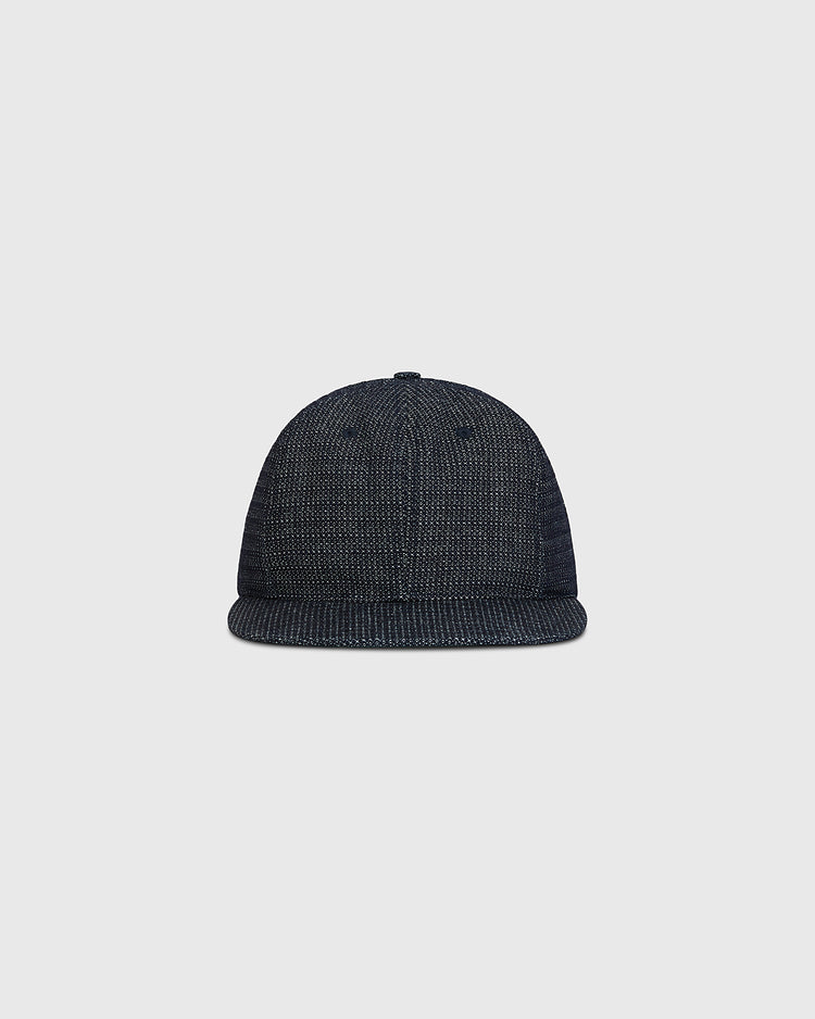 The Ebbets Field Blank Japanese Indigo Cotton Dobby Ballcap, featuring a textured knit and deep blue indigo dye, is shown from the front against a plain light gray background.