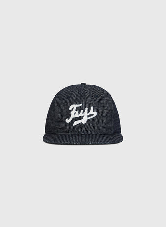 The Ebbets Field Fuji Athletic Club Japanese Indigo Cotton Dobby Ballcap features a dark indigo dye, flat brim, and “Frys” embroidered in white script on the front—a nod to the classic styles worn by Japanese American baseball teams like the Fuji Athletic Club—shown here against a plain light gray background.
