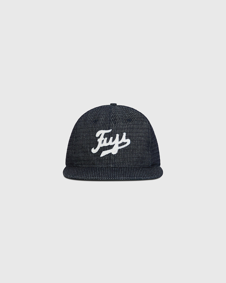 The Ebbets Field Fuji Athletic Club Japanese Indigo Cotton Dobby Ballcap features a dark indigo dye, flat brim, and “Frys” embroidered in white script on the front—a nod to the classic styles worn by Japanese American baseball teams like the Fuji Athletic Club—shown here against a plain light gray background.