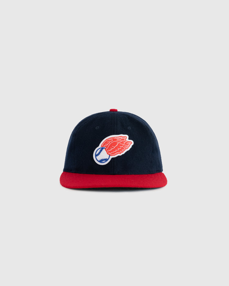 The EFF Rochester Red Wings 1950 Authentic Wool Ballcap features navy wool, a red brim, and an embroidered winged baseball logo on the front. Shown against a plain light gray background.