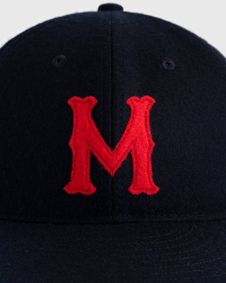 A close-up of the EFF San Francisco Mission Reds 1937 Authentic Wool Ballcap, showing a large red embroidered M on the dark navy front.