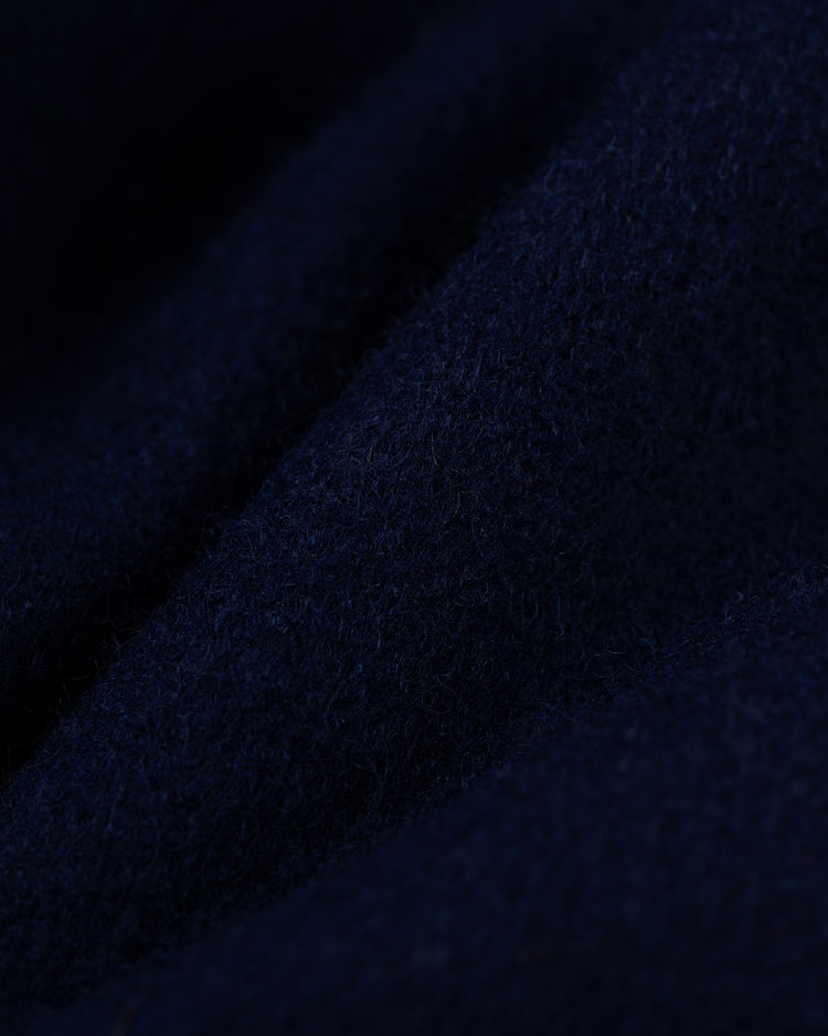 Close-up of dark blue, soft, textured wool with visible fibers and folds, showcasing the warmth and detail of the EFF St. Louis Cardinals 1950 Authentic All Wool Varsity Jacket.