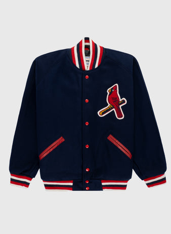 The EFF St. Louis Cardinals 1950 Authentic All Wool Varsity Jacket features a navy design with red and white striped collar, cuffs, and hem, red buttons, red-trimmed pockets, and a bold cardinal patch on the left chest—a true classic replica.