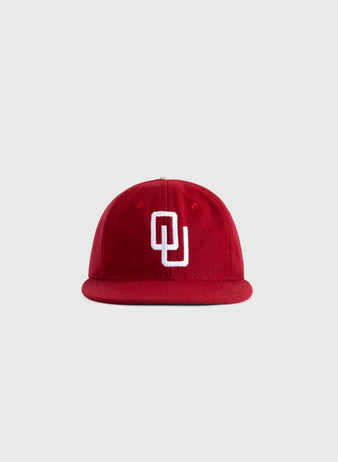 The EFF University of Oklahoma 1975 Authentic Wool Ballcap features a red design with a white interlocking OU logo, inspired by the classic Sooners cap and shown against a plain light gray background.
