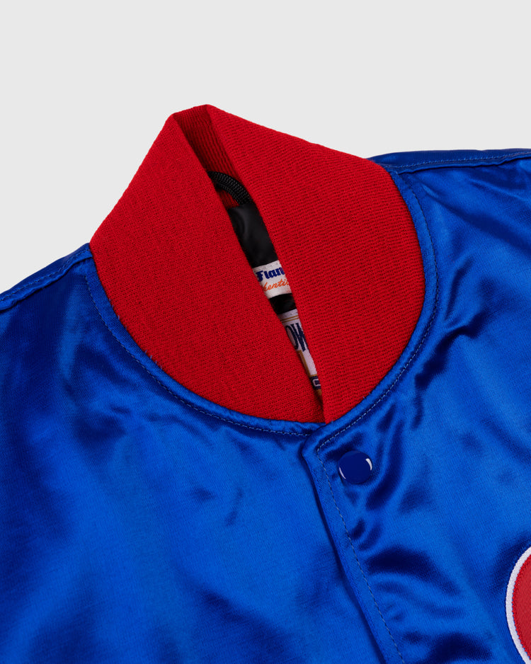 A close-up of the EFF Montreal Expos 1969 Authentic All Satin Varsity Jacket highlights its blue satin finish, bright red ribbed collar, and snap button, showcasing classic baseball style with visible jacket label and patch.