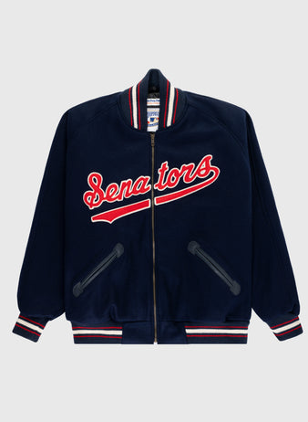 The EFF Washington Senators 1966 Authentic All Wool Varsity Jacket is navy blue with red, white, and blue striped cuffs, collar, and hem. Senators appears in bold red script with a white outline across the chest.