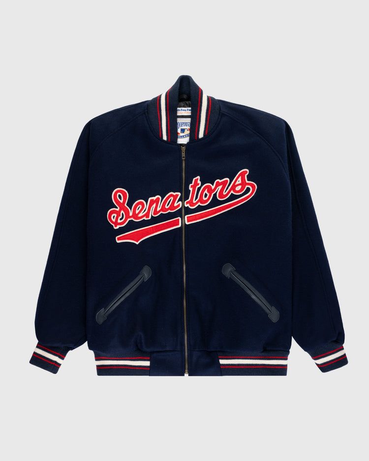 The EFF Washington Senators 1966 Authentic All Wool Varsity Jacket is navy blue with red, white, and blue striped cuffs, collar, and hem. Senators appears in bold red script with a white outline across the chest.