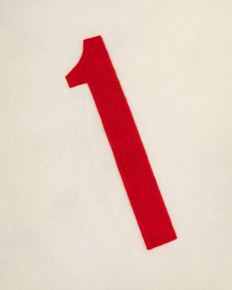 A bold red number one stands out on an off-white background, evoking the iconic EFF Mexico City Red Devils 1957 Authentic Wool Home Jersey from the Mexican League.