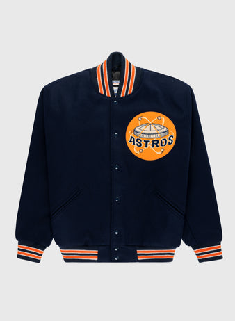 The EFF Houston Astros 1965 Authentic All Wool Varsity Jacket features a retro team logo, navy blue body, and orange/white striped cuffs, collar, and waistband—classic Astrodome-era style.