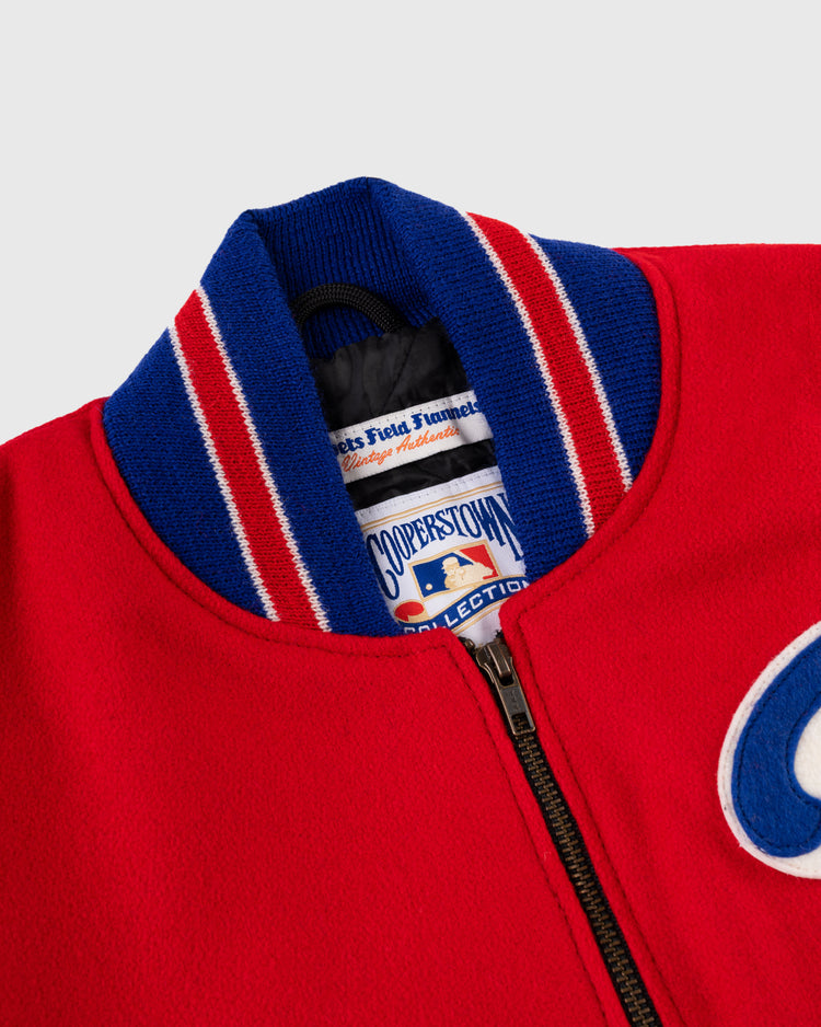Close-up of the EFF Philadelphia Phillies 1949 Authentic All Wool Varsity Jacket in red, featuring a blue and white striped collar, zipper, and Cooperstown Collection and MLB tags inside the neckline.