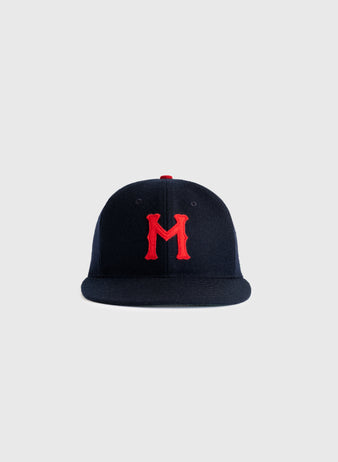 The Minneapolis Millers 1938 Authentic Wool Ballcap by EFF features navy wool with a red M embroidered on the front, inspired by the original 1938 design, displayed on a plain light grey background.