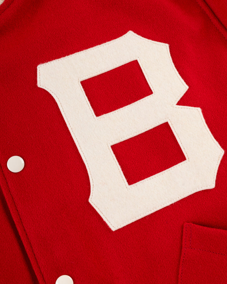 Close-up of the EFF Boston Bees 1939 Authentic All Wool Varsity Jacket, showcasing a large white B patch, white snap buttons, and a red pocket—a true vintage sportswear classic.