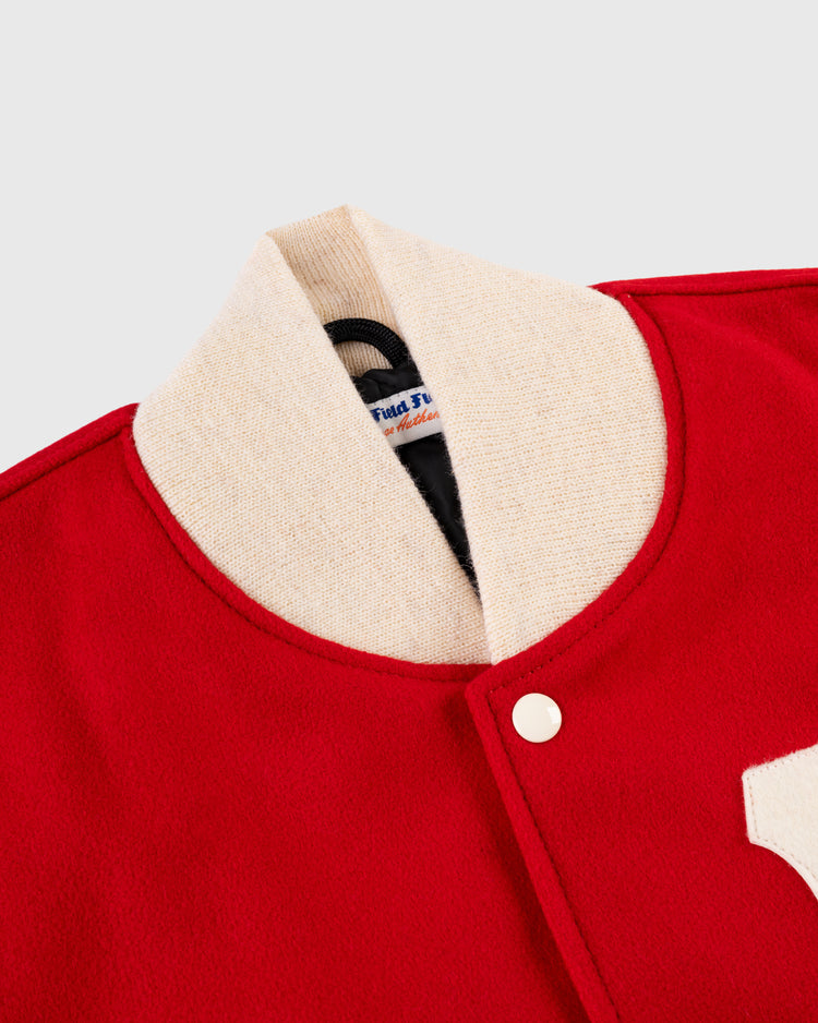 Close-up of EFFs Boston Bees 1939 Authentic All Wool Varsity Jacket, featuring a cream collar, snap button, visible partial white letter patch on the right, inner label, and part of the lining.
