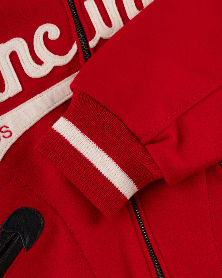 Close-up of the EFF Cincinnati Reds 1969 Authentic All Wool Varsity Jacket, featuring ribbed red and white striped cuffs, a visible zipper, and white embroidered chest lettering in classic vintage style.