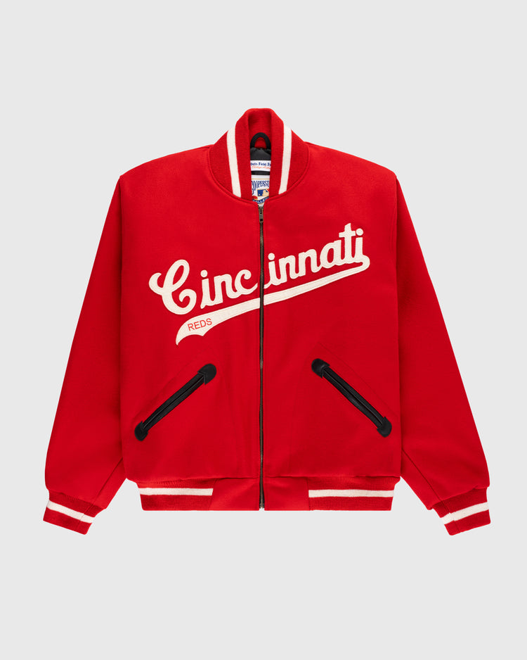 The EFF Cincinnati Reds 1969 Authentic All Wool Varsity Jacket features a red zip-up design, white stripes on the collar, cuffs, and hem, “Cincinnati Reds” in white script on the chest, and black-trimmed front pockets.