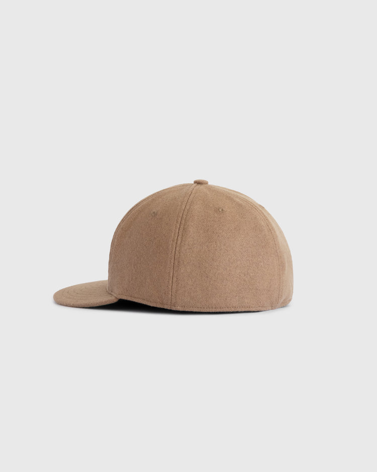 The EFF Homestead Grays G Wool Ballcap is shown from the side against a light gray background, highlighting its plain tan color, curved brim, soft wool fabric, and vintage-inspired design.