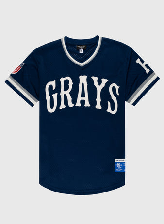 The EFF Homestead Grays Mesh V-Neck Jersey is navy with white trim, GRAYS in bold white letters front, a white H on the sleeve, and historical patches on the right sleeve and lower front—paying tribute to the legendary Grays.