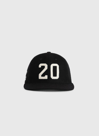 The Ebbets Field Flannels Josh Gibson 1945 Signature Series Wool Ballcap features a black design with a bold white 20 on the front, inspired by vintage Negro Leagues style, shown against a plain light gray background.