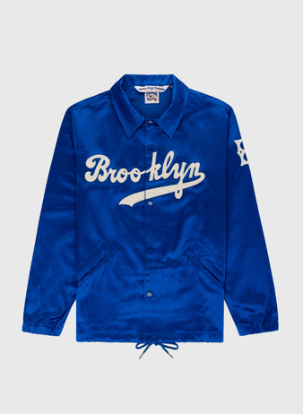 The EFF Brooklyn Dodgers 1945 Satin Windbreaker Jacket is a blue satin jacket with white text, inspired by the legendary Brooklyn Dodgers.