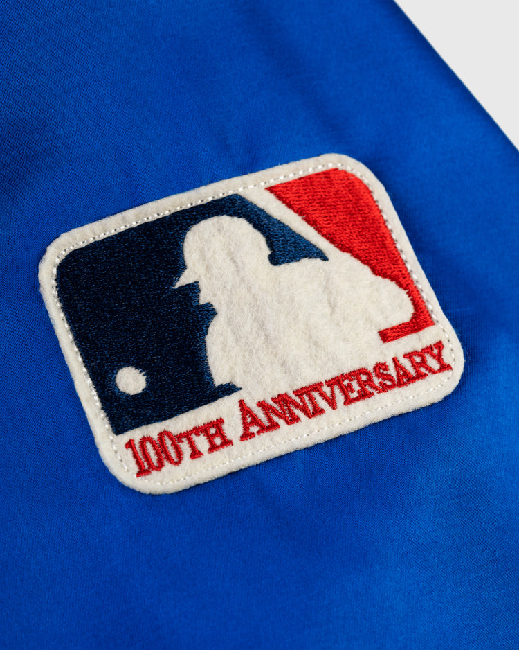Add vintage flair to your Montreal Expos 1969 Satin Windbreaker by EFF with a bright blue patch featuring the Major League Baseball logo and 100th ANNIVERSARY text, sewn on for a classic look.