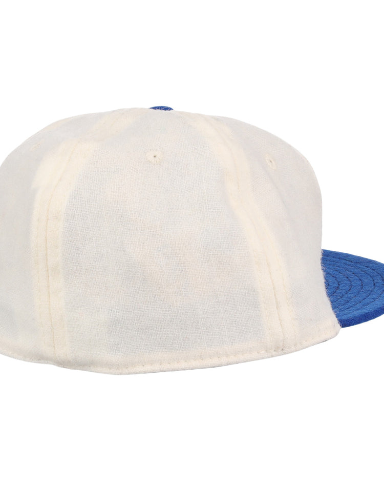 The EFF University of Kentucky 1968 Vintage Ballcap, shown from the back and side, features a white design with a blue brim that highlights its classic style and textured fabric.