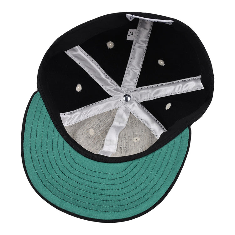The image shows the inside of an EFF University of Kentucky Mascot Vintage Ballcap, featuring a black crown, green underbill, silver lining stripes, white stitching, and ventilation holes—ideal for Wildcat fans.
