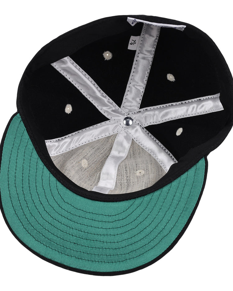 The image shows the inside of an EFF University of Kentucky Mascot Vintage Ballcap, featuring a black crown, green underbill, silver lining stripes, white stitching, and ventilation holes—ideal for Wildcat fans.